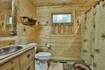 Main level shared bathroom with walk-in shower